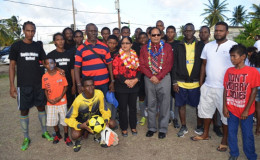 Prime Minister Moses Nagamootoo and his wife Sita posing with residents. (GINA photo)
