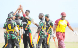 Guyana Jaguars fast bowler Romario Shepherd is congratulated by his teammates after he dismissed Montcin Hodge for a first ball duck. Photo by WICB Media/Randy Brooks of Brooks Latouche Photography 