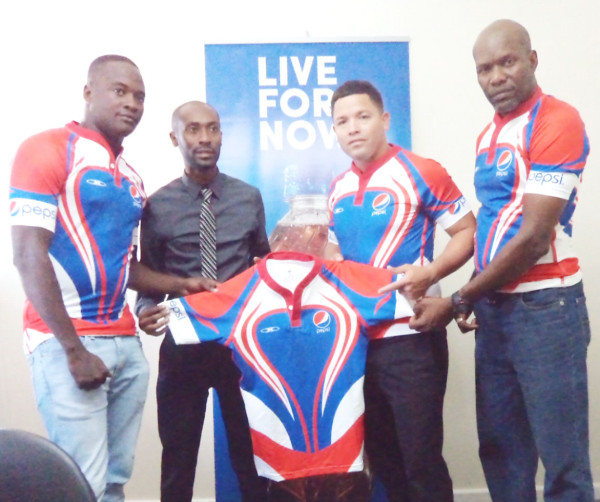 Hornets player, Blaize Bailey, Pepsi’s Brand Manager, Larry Wills, Hornets captain, Ryan Gonsalves and coach of the team Kenneth Grant-Stuart pose with the new outfits. 