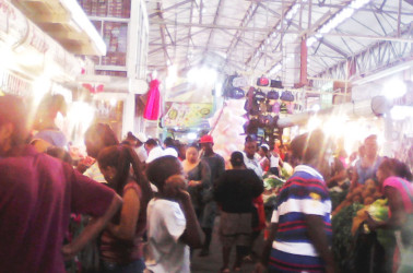 A section of Stabroek Market yesterday where shoppers were buying meat and peas for their cook-up rice  