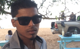 Dewaun Baksh posing for a ‘selfie’ at the Bush Park beach just before meeting his demise
