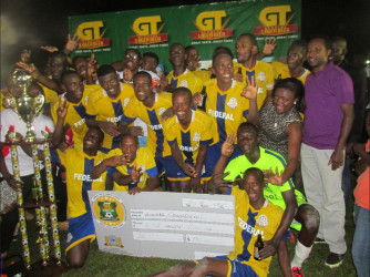 The victorious Federal Winners Connection unit celebrating after clinching their third consecutive UDFA/GT Beer Knockout Championship following their win over Silver Shattas while GT Beer Brand Manager Jeffrey Clement (right/purple) looks on. 