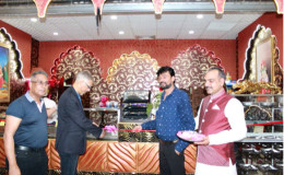 (From left)  Roy Beepat, President of Giftland; Minister of Business,  Dominic Gaskin; Proprietor of Taste of India, Hemant Banga and the Manager of the restaurant at the official opening.