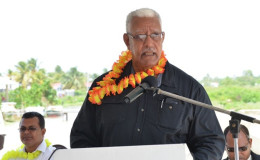 Minister of Agriculture Noel Holder addressing the gathering at the commissioning of the Lima pump station. At left is Region Two Chairman Devanand  Ramdatt. (GINA photo)