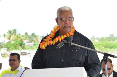 Minister of Agriculture Noel Holder addressing the gathering at the commissioning of the Lima pump station. At left is Region Two Chairman Devanand  Ramdatt. (GINA photo)