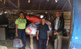 Minister of Communities, Ronald Bulkan (right) at Monkey Mountain (Ministry of Communities photo)