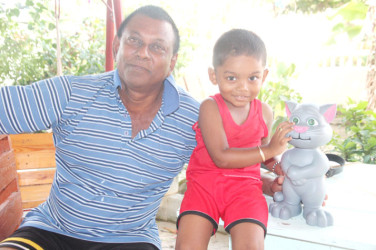 Dwarka Thakur with grandson Prateek
