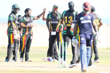 Guyana players celebrate Chadwick Walton’s departure during the Group “B” match between Guyana Jaguars and Combined Campuses & Colleges Marooners in the NAGICO Super50 Tournament yesterday at the St. Paul’s Sports Complex. Photo by WICB Media/Randy Brooks of Brooks Latouche Photography.