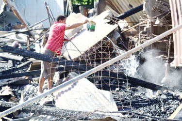 One of the persons that was monitoring the site in the aftermath of the fire (Keno George photo)