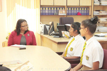 Minister of Social Protection Volda Lawrence meeting the QC students. 