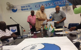 GWI’s Chief Executive Officer Dr. Richard Van West- Charles (left) and Director of the IAST Dr. Suresh Narine (right) seal the deal with a handshake at Friday’s signing of the Memorandum of Understanding.