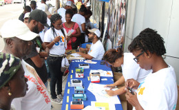 GTT employees engaging members of the public during the first of a series of Mobile Fairs that the company has planned. (Photo by Keno George)