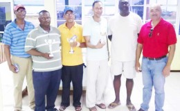 In picture, Eon Caesar and Oncar Ramroop pose with the winners of Saturday’s tournament. From L to R are P. Prashad, M. Gayadin, R. Cummings, A. Cummings, Caesar and Ramroop.

