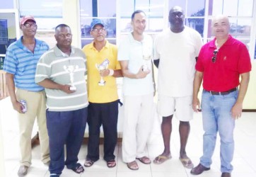 In picture, Eon Caesar and Oncar Ramroop pose with the winners of Saturday’s tournament. From L to R are P. Prashad, M. Gayadin, R. Cummings, A. Cummings, Caesar and Ramroop. 