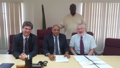 Minister of Natural Resources, Raphael Trotman (centre) flanked by British High Commissioner to Guyana Greg Quinn and John McKenna of Tullow Oil. (Ministry of the Presidency photo)        