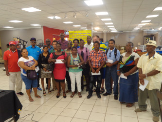 Some of the Mabe promotion winners at the Courts Main Street branch on Tuesday. Photo courtesy of Courts Guyana Inc.   