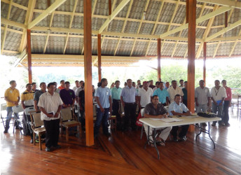 Leaders of the 20 North Rupununi Communities witnessing the signing of the agreements by Dane Gobin, CEO of Iwokrama Centre (seated left) and Anthony Andries, Chairman of the North Rupununi District Development Board (seated right) at the Iwokrama River Lodge at Kurupukari (Iwokrama photo)
