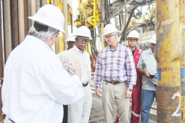 President David Granger (centre), visits ExxonMobil's oil rig (SN file photo)