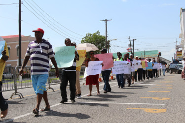 Sugar workers and others picketing outside of Parliament yesterday over the planned closure of the Wales estate. (Keno George photo) 