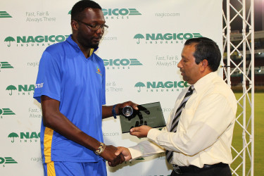 Sulieman Benn receives the Player-of-the-Match prize during the second semi-final between Windward Islands Volcanoes and Barbados Pride in the NAGICO Super50 Tournament yesterday at Queen’s Park Oval. Photo by WICB Media/Ashley Allen