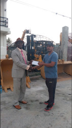  In picture, Guy Griffith, PRO Lusignan Golf Club receives a cheque for sponsorship of the tournament from Vish Ramdial, Director of Vish Trading Incorporated.