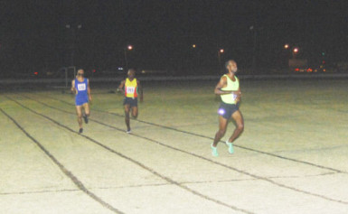 Caption Running Brave Athletic Club’s Cleveland Thomas powers across the finish line to win the 3000m Open male event. (Orlando Charles photo) 