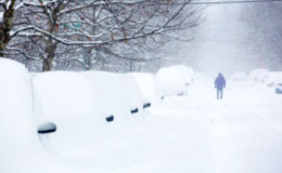 Struggling home through the snow (BBC)
