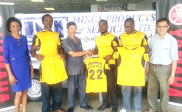 Director of Ming’s Products and Services, Colin Ming Snr., hands over the 15s kit to Secretary of the club, Walter George, in the presence of staff members of the company.