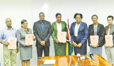 Ministers of Public Infrastructure, David Patterson (third from left) and Annette Ferguson (fifth from left) with the board members of Guyana Power and Light Inc. (Ministry of Public Infrastructure photo) 