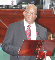 Finance Minister Winston Jordan addresses the National Assembly during his presentation of the proposed 2016 national budget. The theme of the $230 billion budget is ‘Stimulating Growth, Restoring Confidence: The Good Life Beckons.’ (Photo by Keno George)