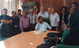 This PSC photo shows AG Basil Williams (seated) surrounded by members of the private sector delegation.