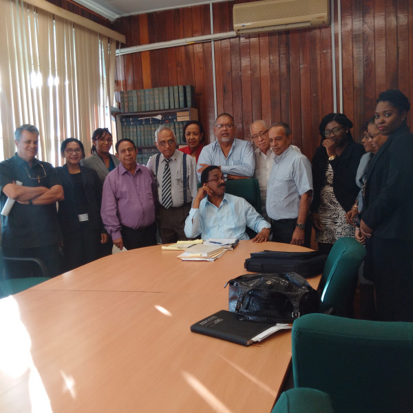 This PSC photo shows AG Basil Williams (seated) surrounded by members of the private sector delegation.