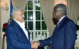 Indian businessman Vijay Mallya (left) greets Barbados Prime Minister Freundel Stuart during a courtesy call. (Photo courtesy Government Information Service)
