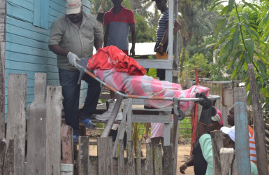 Undertakers removing the body 