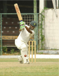 Robin Bacchus drives sweetly during his half-century yesterday