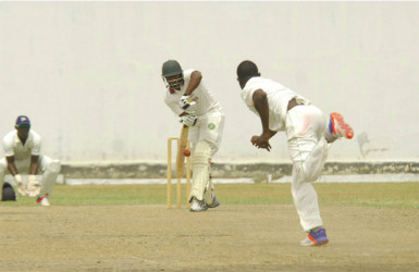 Kandasammy Surujnarine defends a delivery from pacer Keon Joseph.