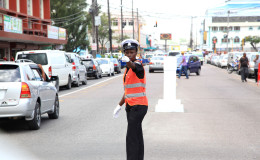 A City Constabulary Officer directs traffic at Regent and King streets. (Photo by Keno George)