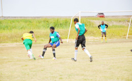 Job Caesar (left) of defending champion Chase Academy on the attack down the left flank during his side’s lopsided win over St.Winifred Secondary in the 4th Annual Milo Secondary School u-20 Championships yesterday. Pix saved as Milo 7 in sported
 