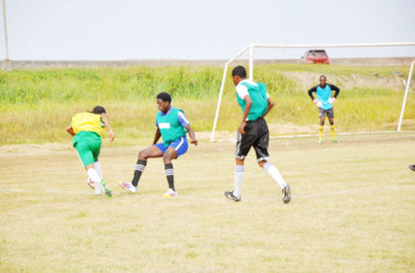Job Caesar (left) of defending champion Chase Academy on the attack down the left flank during his side’s lopsided win over St.Winifred Secondary in the 4th Annual Milo Secondary School u-20 Championships yesterday. Pix saved as Milo 7 in sported   