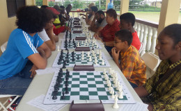 The January Trophy Stall tournament has created an opening for the Guyana Chess Federation to placidly observe for the remainder of the year. The tournament has generated the kind of activity that is required for chess, in that it has brought out the seasoned players and some young, bright faces. It means therefore, the young and the chess-matured still have an interest in playing the tantalizing brain game. The fervour has not waned. The photo shows another section of the participants doing battle at the Trophy Stall tournament.
