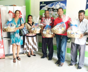 Grand prize winner Bibi Ramsaram (second left) with some of the winners of consolation prizes.  