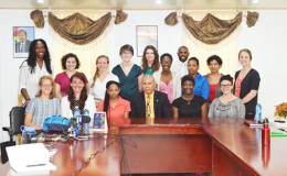 The Peace Corps Volunteers with Public Health Minister, Dr. George Norton  (GINA photo)
