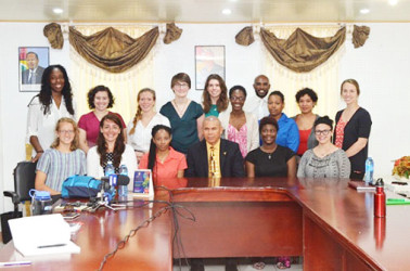 The Peace Corps Volunteers with Public Health Minister, Dr. George Norton  (GINA photo) 