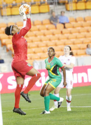 HEROINE! Lady Jaguars goalkeeper Chantelle Sandiford produced a number of outstanding saves yesterday to help the team defeat Guatemala and move a step closer to a semi-final berth. 