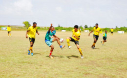 Action between St. Rose’s High and Freeburg Secondary during the 4th Annual Milo Secondary Schools football championship at the Ministry of Education ground yesterday.
