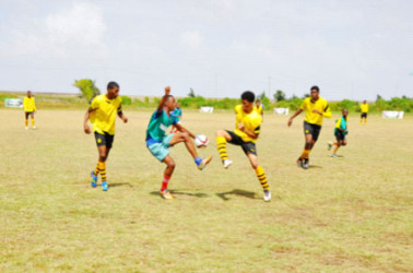 Action between St. Rose’s High and Freeburg Secondary during the 4th Annual Milo Secondary Schools football championship at the Ministry of Education ground yesterday. 