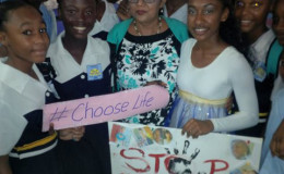 Mrs Sita Nagamootoo is flanked by children of the Central High School (Ministry of Education photo)