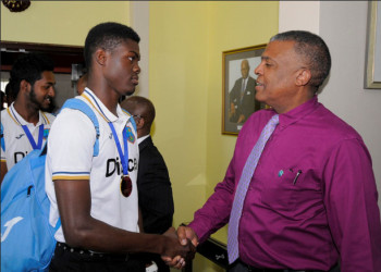  Fast bowler Alzarri Joseph chats with WICB CEO Michael Muirhead following the squad’s arrival. (Photo courtesy WICB Media). 