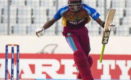 All-rounder Shamar Springer celebrates after striking the winning runs in the semi-final against Bangladesh. 