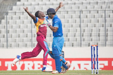 Fast bowler Chemar Holder celebrates a wicket during the final. 